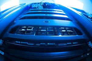 A close up of a computer server with blue lights photo
