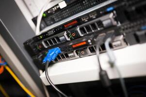 A close up of a server with multiple cables photo