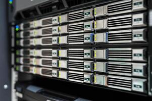 A server rack with many different types of servers photo