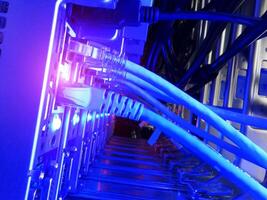 A close up of a computer server with blue lights photo