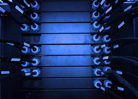 A rack of servers with blue lights photo