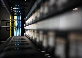 A close up of a rack of cables in a data center photo