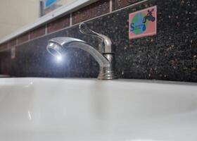 A sink with a faucet photo
