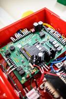 A red box with electronics inside of it photo