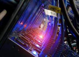 A close up of a computer server with wires and lights photo