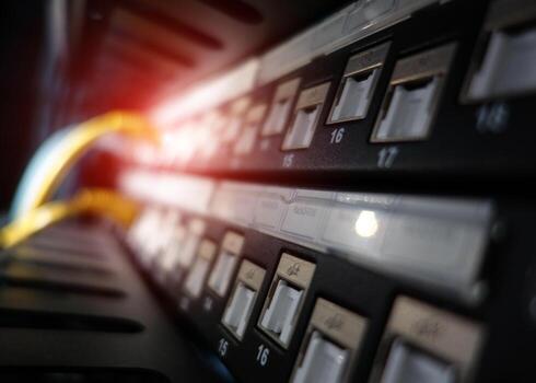 A close up of a network server with wires photo