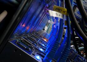 A close up of a computer server with blue lights photo
