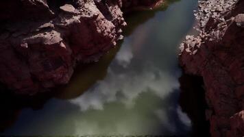Reflections of clouds in the calm waters of the Colorado River canyon video