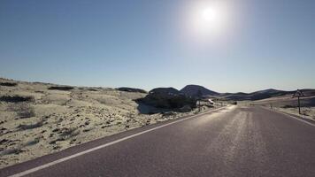 Deserted road winding through the vast Mongolian landscape under bright sun video
