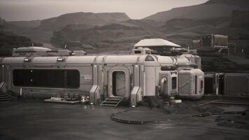 Colonist base established on a distant planet with rugged terrain and habitats video