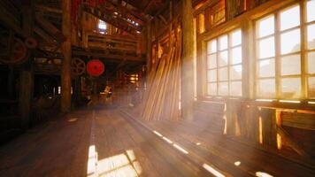 Sunlight streams through windows in a rustic workshop filled with tools video