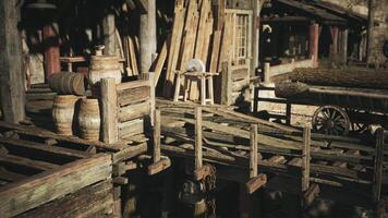 Wooden dock with barrels and a stool at a rustic village during the afternoon video