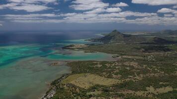 The view from the bird's eye view of the fishing village and the mountains. Indian ocean. Mauritius photo
