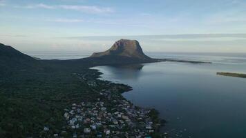 Beautiful bird's-eye view of mount Le Morne Brabant and the waves of the Indian ocean in Mauritius.Underwater waterfall near mount Le Morne in the Indian ocean photo