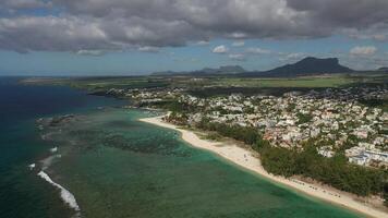 bird's eye view of a suburb with a beautiful white beach on the island of Mauritius. photo