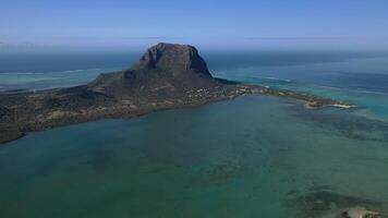 Beautiful bird's-eye view of mount Le Morne Brabant and the waves of the Indian ocean in Mauritius.Underwater waterfall near mount Le Morne in the Indian ocean photo