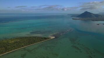 Beautiful bird's-eye view of mount Le Morne Brabant and the waves of the Indian ocean in Mauritius.Underwater waterfall near mount Le Morne in the Indian ocean photo