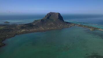 Beautiful bird's-eye view of mount Le Morne Brabant and the waves of the Indian ocean in Mauritius.Underwater waterfall near mount Le Morne in the Indian ocean photo