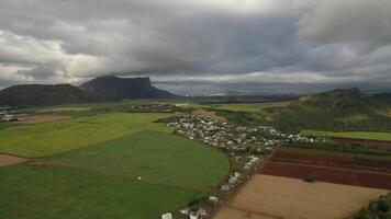 Aerial photography of the beautiful green countryside of Mauritius with fields and mountain views photo