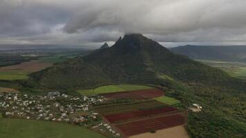 Aerial photography of the beautiful green countryside of Mauritius with fields and mountain views photo