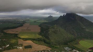 Aerial photography of the beautiful green countryside of Mauritius with fields and mountain views photo