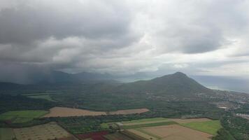 top view of rural fields and rain in the distance, Mauritius photo