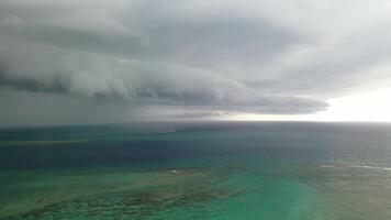 Storm clouds in the sky as it moves over the ocean. Epic tropical storm clouds. Indian ocean.Mauritius photo