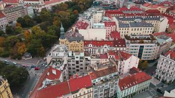 Prague architecture, aerial view. Flight over historical buildings with red roofs in European city. Birds eye view of cityscape of Praha, Czech Republic video