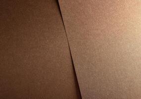 Glossy designer paper background with a bronze and copper gradient, featuring a shimmering metallic photo