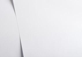 Elegant designer paper background with a soft, pearlescent white tone and subtle gloss. This photo