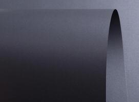Designer paper background with a dark gray, wavy texture and subtle gradient. Featuring a crinkled, photo