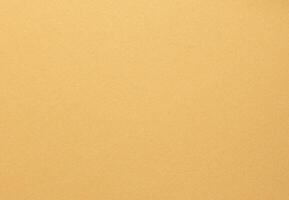 Yellow designer paper texture with a minimalist, smooth surface. Warm beige and neutral tones create photo