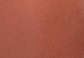 Designer paper background with a velvety, matte texture in warm earthy tones, blending shades of photo