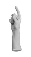 Female hand in pointing gesture with index finger extended upward, thumb relaxed, directing photo