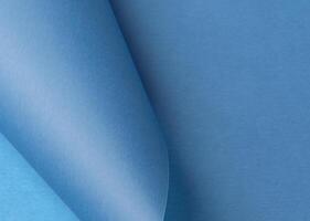 Soft blue paper background with a smooth, pastel texture, creating a simple yet luxurious feel. This photo