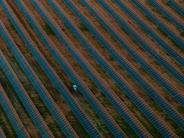 Aerial View of Solar Panel Farm in Lithuania with Geometric Patterns photo