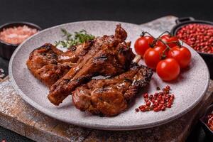 Ribs or rack of beef baked on the grill with salt, spices and herbs photo