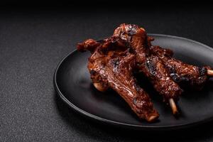 Ribs or rack of beef baked on the grill with salt, spices and herbs photo
