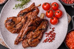 Ribs or rack of beef baked on the grill with salt, spices and herbs photo