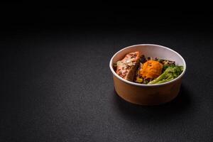 Grilled salmon with salt and spices, broccoli, tomatoes, rice photo
