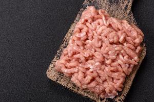 Raw minced chicken with salt, spices and herbs photo