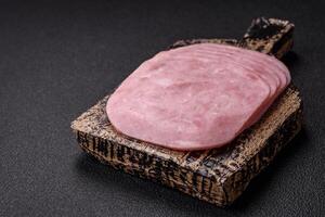 Ham, spam with salt, spices and herbs cut into slices photo