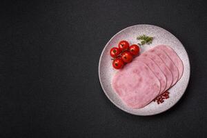 Ham, spam with salt, spices and herbs cut into slices photo