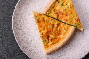 Delicious quiche with broccoli, chicken or salmon and cheese photo