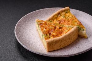 Delicious quiche with broccoli, chicken or salmon and cheese photo