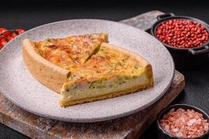 Delicious quiche with broccoli, chicken or salmon and cheese photo