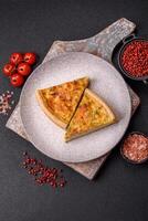 Delicious quiche with broccoli, chicken or salmon and cheese photo