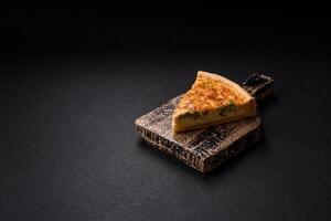 Delicious quiche with broccoli, chicken or salmon and cheese photo