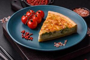 Delicious quiche with broccoli, chicken or salmon and cheese photo
