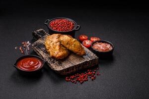 Chicken fillet pieces marinated with salt and spices photo